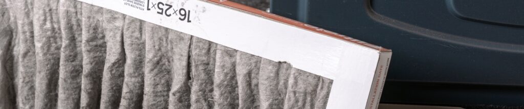 dirty clogged furnace filter being removed showing how to choose a furnace filter