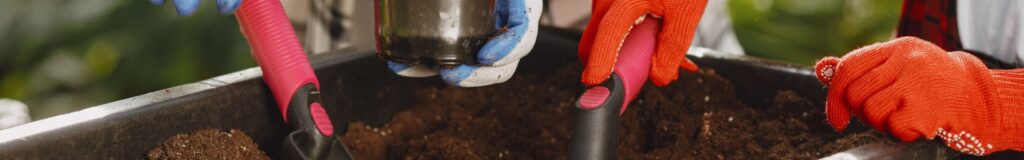 Raised bed soil calculator — gardener filling a raised garden bed with soil