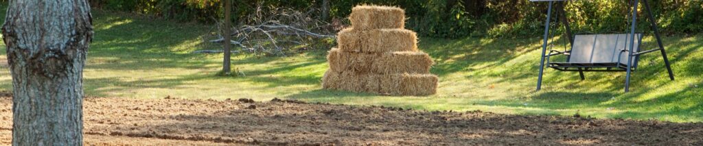 how to grade a yard for drainage — freshly graded and raked yard ready for seeding