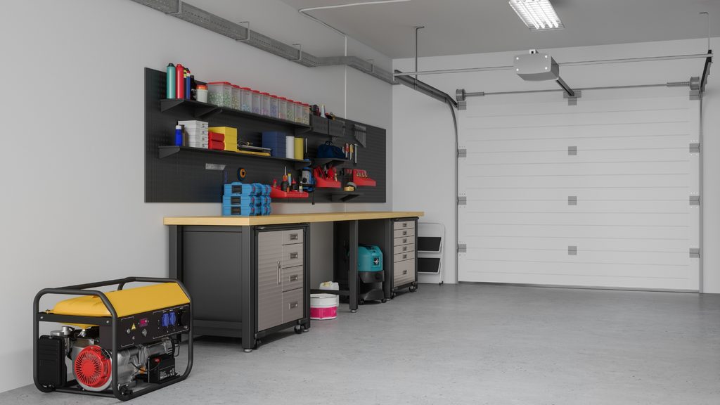 organized garage workbench with dark cabinets and overhead shelving