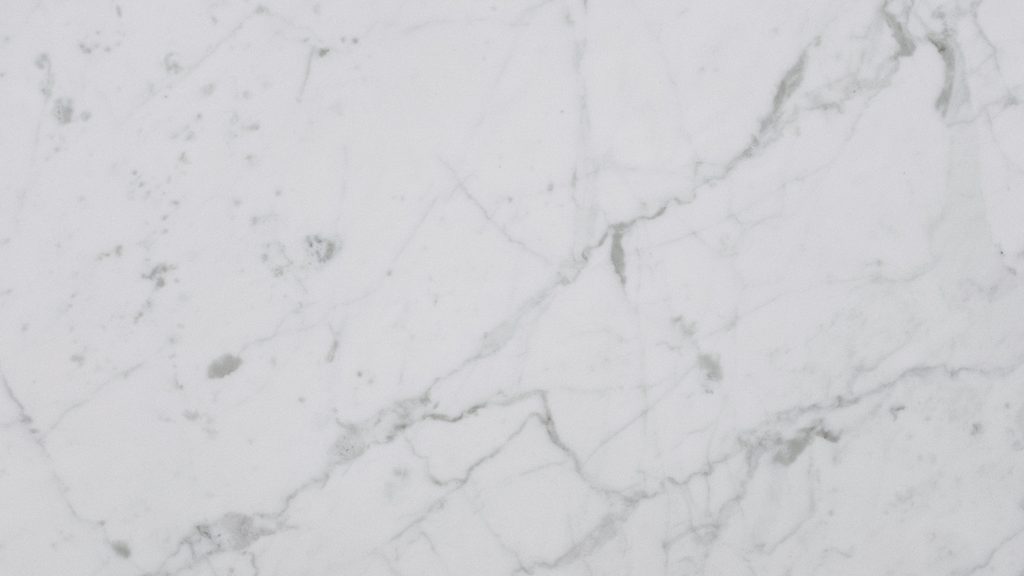 Close-up of a white and gray granite countertop surface showing natural veining